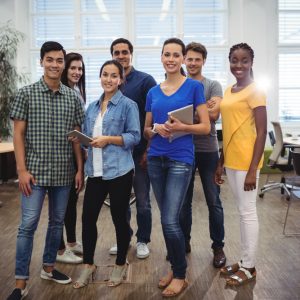 group-business-executives-smiling-camera